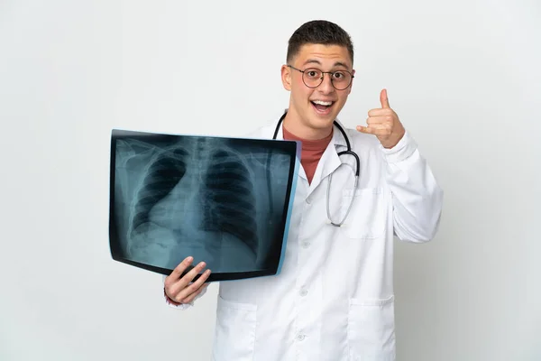 Professional traumatologist on white background making phone gesture. Call me back sign