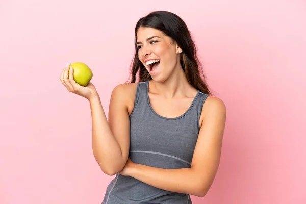 Ung Kaukasisk Kvinna Isolerad Rosa Bakgrund Med Ett Äpple Och — Stockfoto