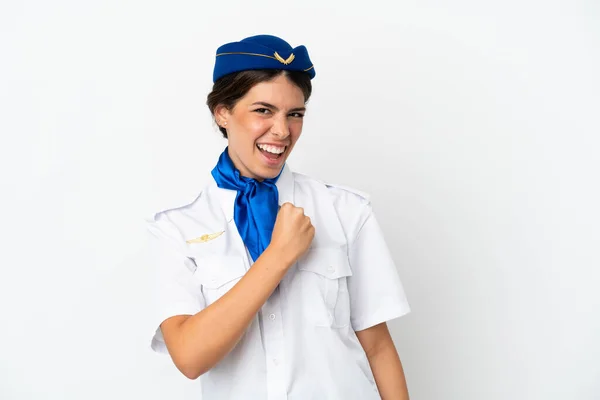 비행기의 스튜워디스 카시아 여성은 승리를 자축하는 배경으로 고립되었다 — 스톡 사진