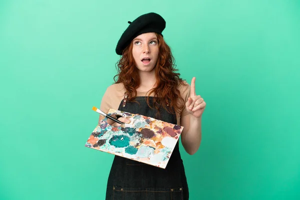 Teenager Redhead Artist Holding Palette Isolated Green Background Intending Realizes — Stock Photo, Image