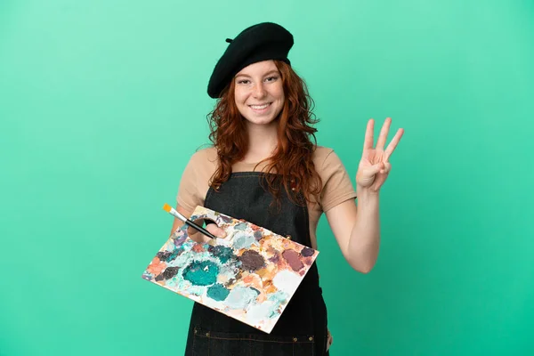 Adolescente Pelirroja Artista Sosteniendo Una Paleta Aislada Sobre Fondo Verde —  Fotos de Stock