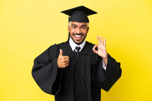 Young University Graduate Colombian Man Isolated Yellow Background Showing Sign — Stockfoto
