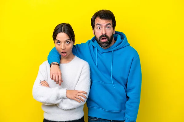 Young Caucasian Couple Isolated Yellow Background Surprise Facial Expression — ストック写真