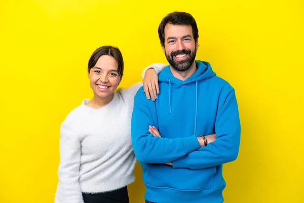 Young Caucasian Couple Isolated Yellow Background Happy Laughing — Stock fotografie