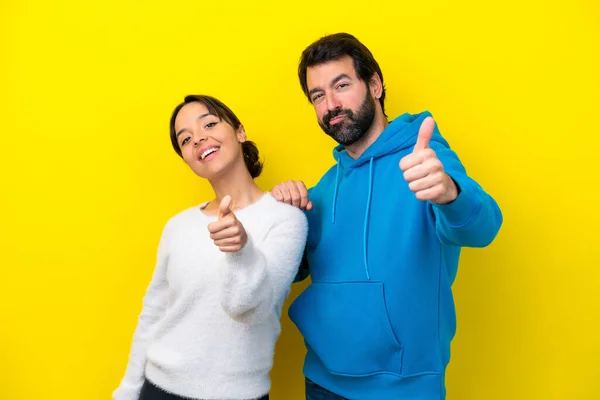Young Caucasian Couple Isolated Yellow Background Giving Thumbs Gesture — 图库照片