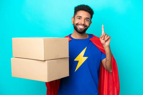 Super Hero Delivery Brazilian Man Isolated Blue Background Pointing Great — Stock Photo, Image