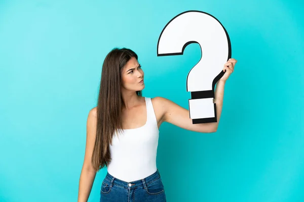 Young Brazilian Woman Isolated Blue Background Holding Question Mark Icon — Stock Photo, Image