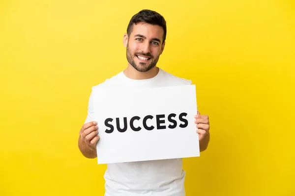 Young Handsome Caucasian Man Isolated Yellow Background Holding Placard Text — Stock Photo, Image