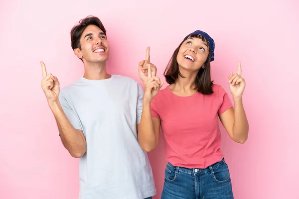 Young Couple Isolated Pink Background Pointing Index Finger Great Idea — Stock Photo, Image