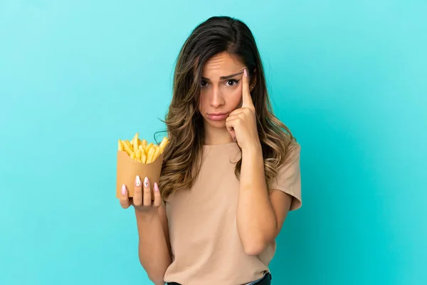 Young Woman Holding Fried Chips Isolated Background Thinking Idea — Stock Photo, Image