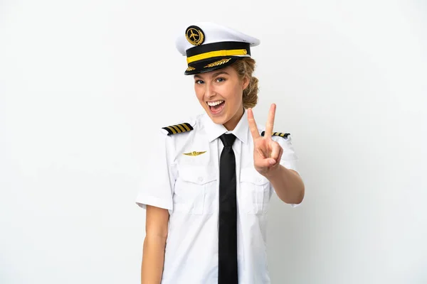 Flugzeug Blonde Pilotin Isoliert Auf Weißem Hintergrund Lächelnd Und Zeigt — Stockfoto