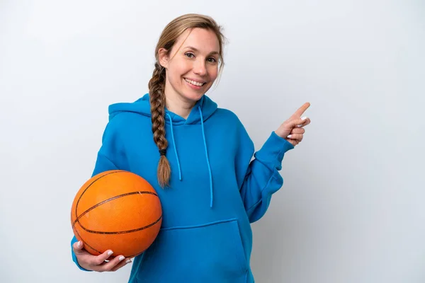 Young Caucasian Woman Playing Basketball Isolated White Background Pointing Finger — Stok fotoğraf