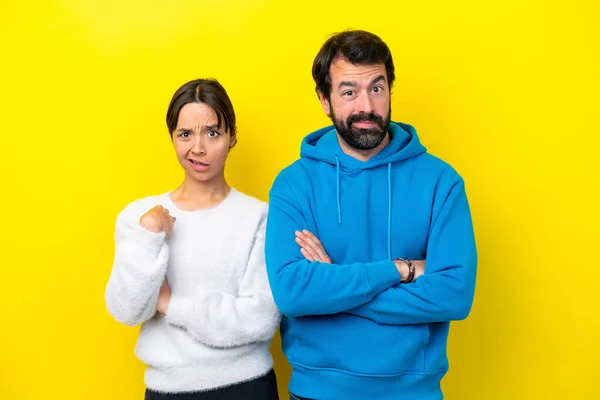 Young Caucasian Couple Isolated Yellow Background Annoyed Angry Furious Gesture — Stock Photo, Image