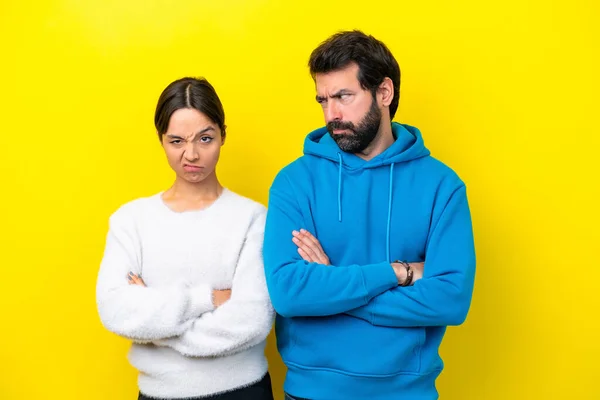 Young Caucasian Couple Isolated Yellow Background Annoyed Angry Furious Gesture — 스톡 사진