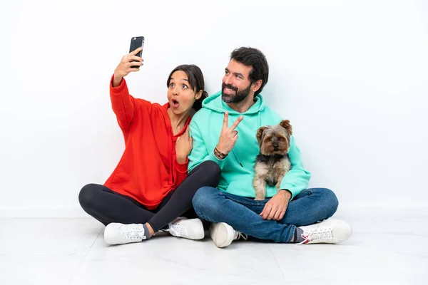 Young Caucasian Couple Sitting Floor Pet Isolated White Background Making — Foto Stock