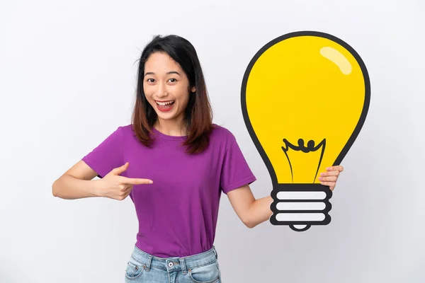 Young Vietnamese Woman Isolated White Background Holding Bulb Icon Pointing — Stock Photo, Image