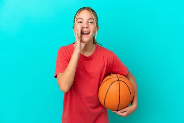 Little Caucasian Girl Playing Basketball Isolated Blue Background Shouting Mouth — Foto Stock