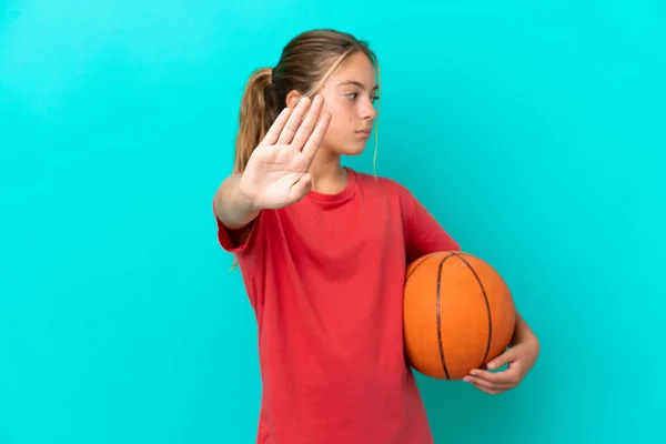 Little Caucasian Girl Playing Basketball Isolated Blue Background Making Stop — Foto Stock