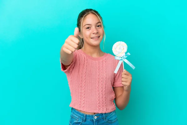 Little Caucasian Girl Holding Lollipop Isolated Blue Background Thumbs Because — Stockfoto