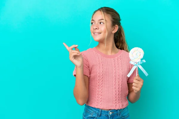 Little Caucasian Girl Holding Lollipop Isolated Blue Background Intending Realizes — Stockfoto