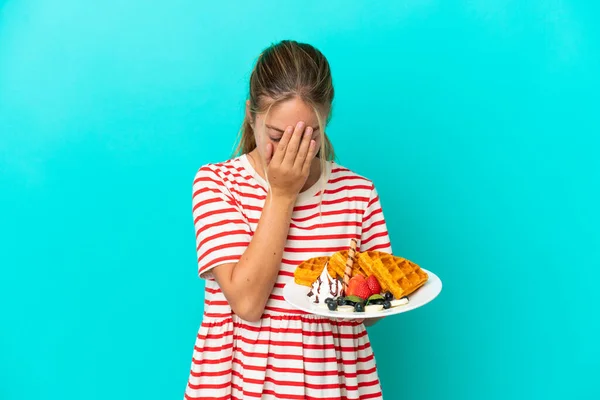 Little Caucasian Girl Holding Waffles Isolated Blue Background Tired Sick — Stock Photo, Image