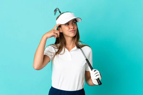 Young Woman Isolated Blue Background Playing Golf Having Doubts Confuse — Fotografia de Stock