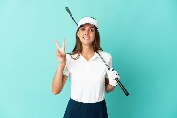 Žena Hraje Golf Přes Izolované Modré Pozadí Úsměvem Ukazuje Vítězství — Stock fotografie