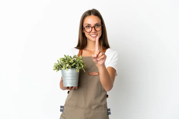 Gardener Girl Holding Plant Isolated White Background Showing Lifting Finger — Stockfoto