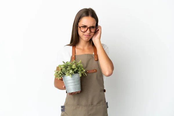 Gardener Girl Holding Plant Isolated White Background Frustrated Covering Ears — Foto de Stock