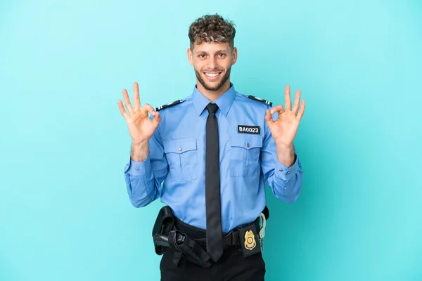 Young Police Blonde Man Isolated White Blue Background Showing Sign —  Fotos de Stock