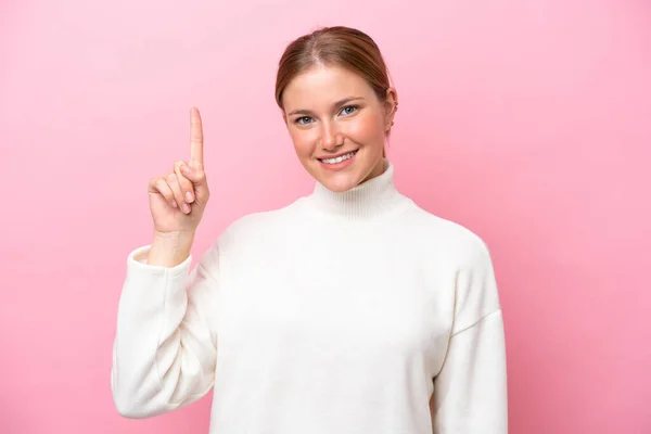Jonge Kaukasische Vrouw Geïsoleerd Roze Achtergrond Wijzend Een Geweldig Idee — Stockfoto