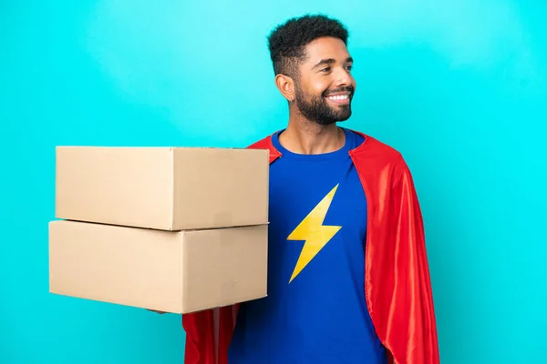 Super Hero Delivery Brazilian Man Isolated Blue Background Looking Side — Stock Photo, Image