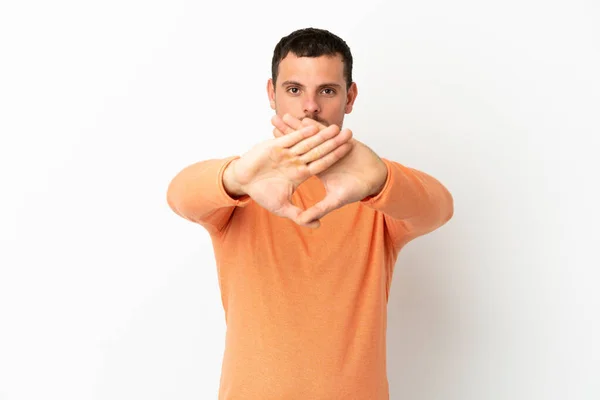 Brazilian Man Isolated White Background Making Stop Gesture Her Hand — Zdjęcie stockowe