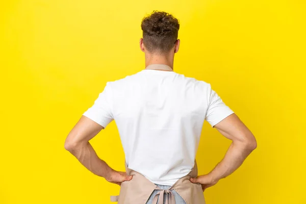 Restaurant Waiter Blonde Man Isolated Yellow Background Back Position — Stok fotoğraf