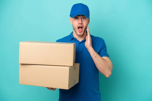 Delivery Caucasian Man Isolated Blue Background Surprise Shocked Facial Expression — Stock Photo, Image