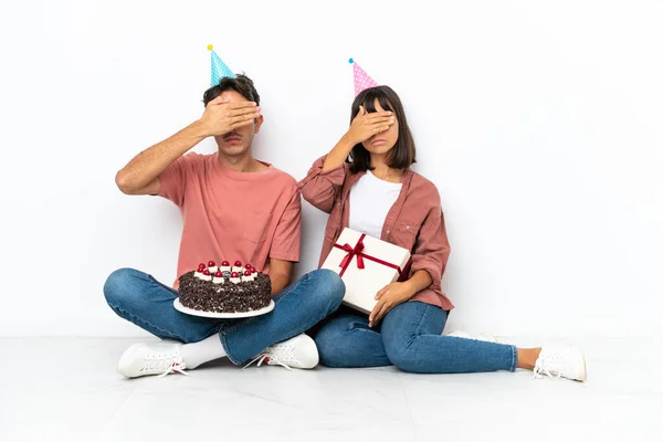 Young Mixed Race Couple Celebrating Birthday Sitting Floor Isolated White —  Fotos de Stock