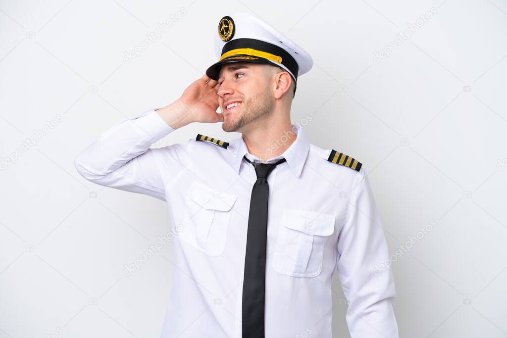 Airplane caucasian pilot isolated on white background has realized something and intending the solution