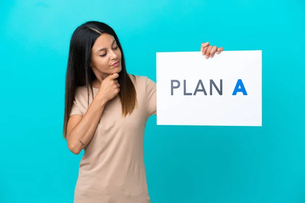 Young Woman Isolated Background Holding Placard Message Plan Thinking — Stockfoto