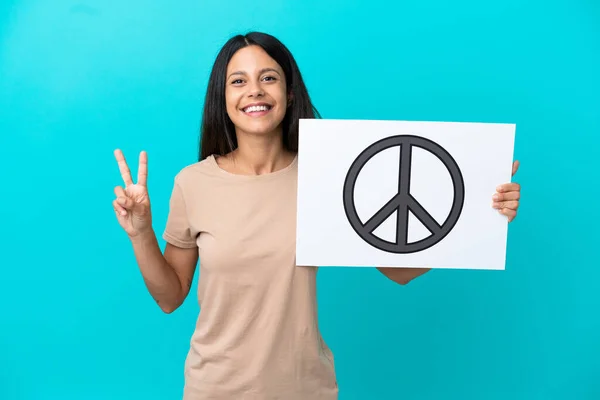 Young Woman Isolated Background Holding Placard Peace Symbol Celebrating Victory — Fotografia de Stock