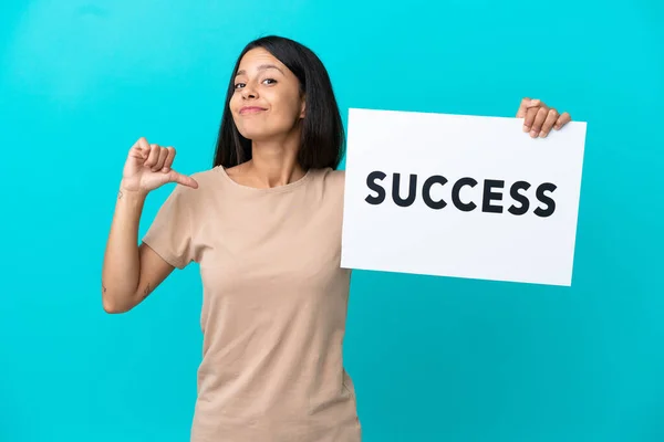 Young Woman Isolated Background Holding Placard Text Success Proud Gesture — Stockfoto