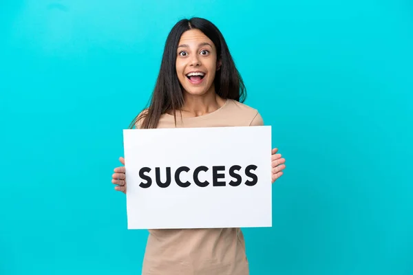 Young Woman Isolated Background Holding Placard Text Success Surprised Expression — ストック写真