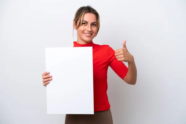 若いですCaucasian女性絶縁上の白い背景保持空のプラカードとともに親指アップ — ストック写真