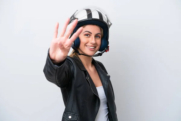 若いですCaucasian女性とともにオートバイヘルメット隔離上の白い背景幸せなとカウント4とともに指 — ストック写真