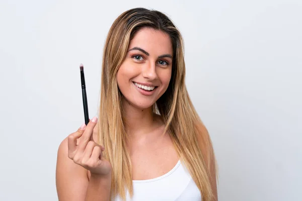 Young Caucasian Woman Isolated White Background Holding Makeup Brush Whit — Stock Photo, Image