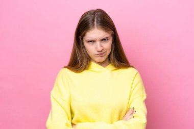 Teenager Russian girl isolated on pink background with unhappy expression