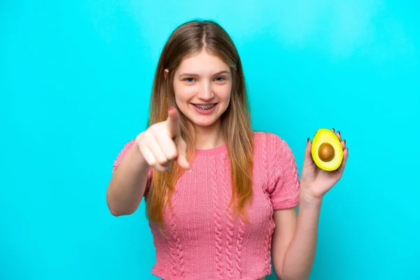 Teenager Russian Girl Holding Avocado Isolated Blue Background Points Finger — Stock Photo, Image