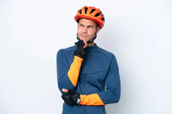 Young Cyclist Caucasian Man Isolated White Background Having Doubts Thinking —  Fotos de Stock