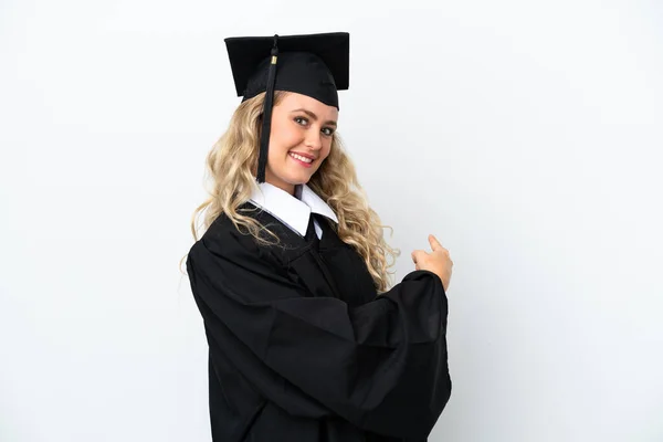 Jovem Universitária Graduada Mulher Isolada Fundo Branco Apontando Para Trás — Fotografia de Stock
