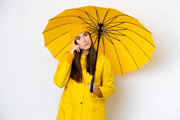 Young Brazilian Woman Rainproof Coat Umbrella Isolated White Background Thinking — Stock Photo, Image