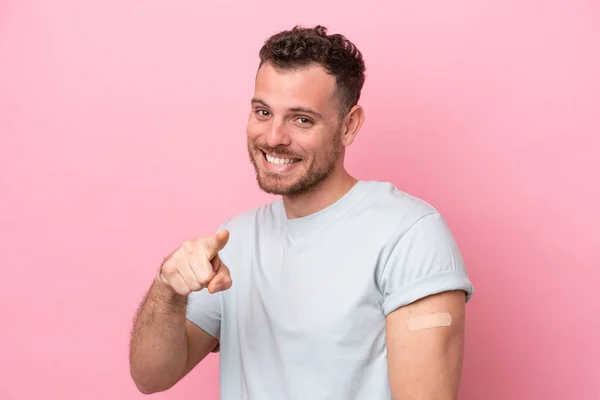 Young Brazilian Man Wearing Band Aids Isolated Pink Background Points —  Fotos de Stock